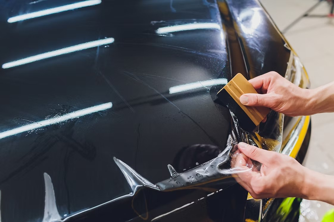 Close view of paint protection film installation